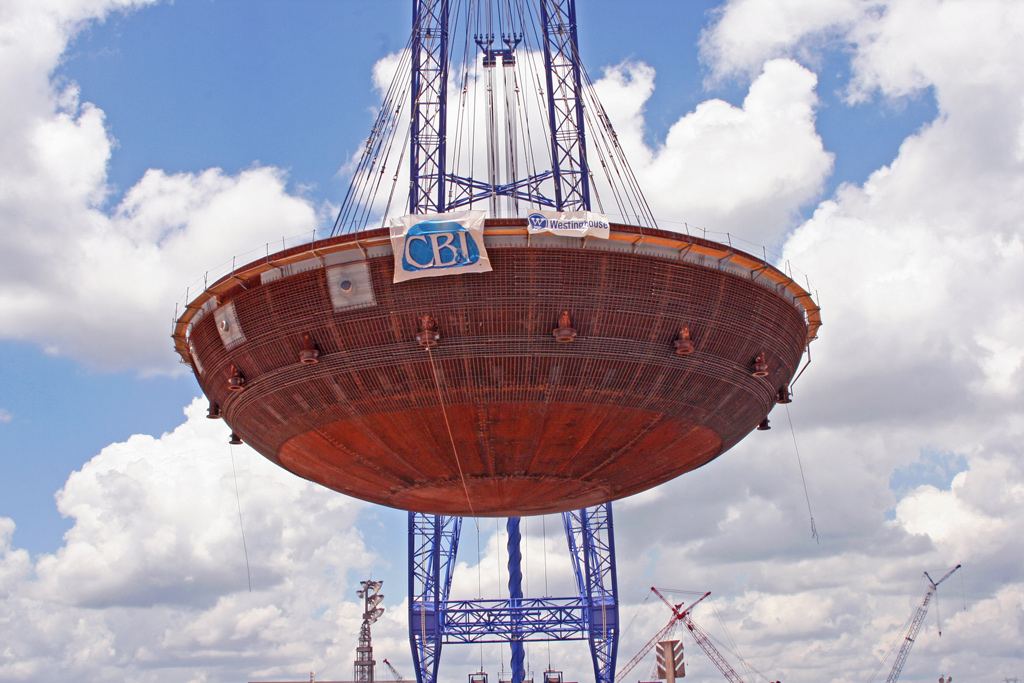 Containment vessel head suspended from a heavy-lift crane at Plant Vogtle